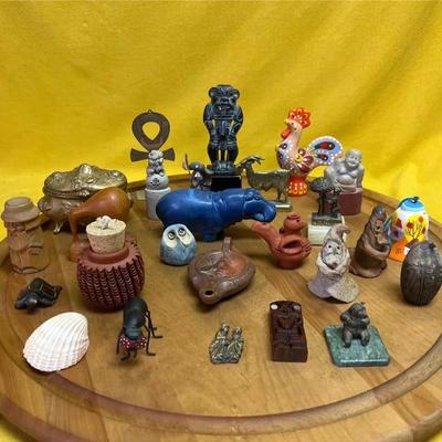 A collection of assorted miniature decorative figurines and objects