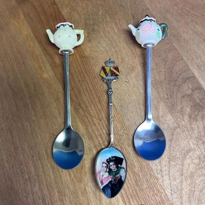 Decorative souvenir spoons with teapot and crest finials