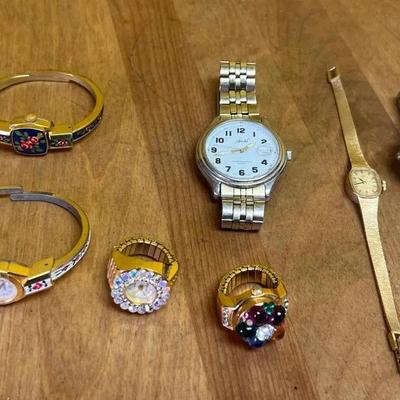 A collection of vintage fashion watches and gemstone watch rings