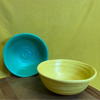 Two vintage Ferrel Pottery ceramic bowls in turquoise and yellow with ribbed design