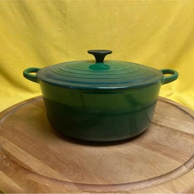 A vintage green enameled cast iron Le Creuset Dutch oven