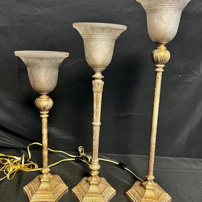 Three Gold-Tone Torchiere Style Table Lamps (Graduated Heights)