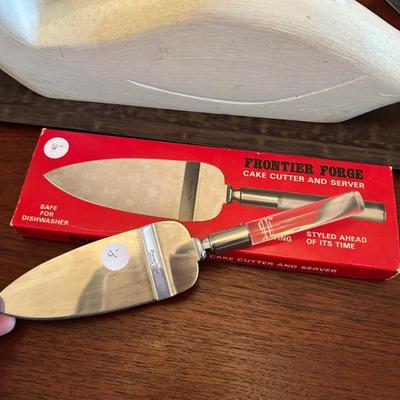 Sale Photo Thumbnail #172: 2 cake servers with acrylic handles available. One with box. 