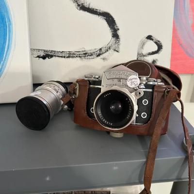 Sale Photo Thumbnail #52: Vintage german film camera and case. 