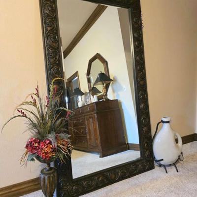 Oversized floor or wall mirror. 