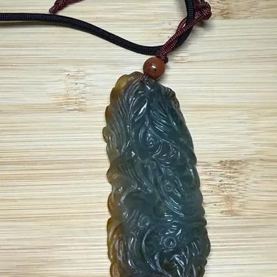 Carved jadeite pendant