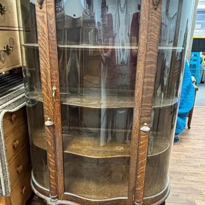 Antique Wood Curio Cabinet With Carved Faces And Claw Feet On Wheels