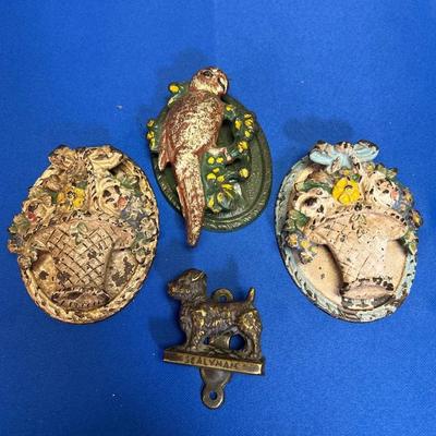 Collection of vintage cast iron door knockers with floral and animal motifs