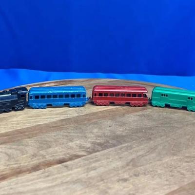 Vintage Midgetoy die-cast metal steam locomotive and passenger train set