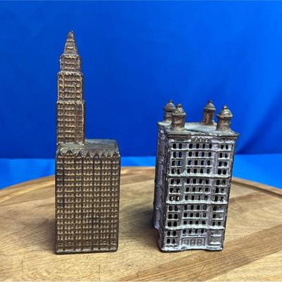 Antique cast iron building banks, likely representing NYC landmarks