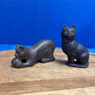 A pair of antique cast iron cat still banks