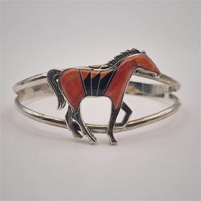 Sale Photo Thumbnail #23: Lot 040   
Sterling Silver Vintage Navajo Spiny Oyster Shell Horse Cuff Bracelet