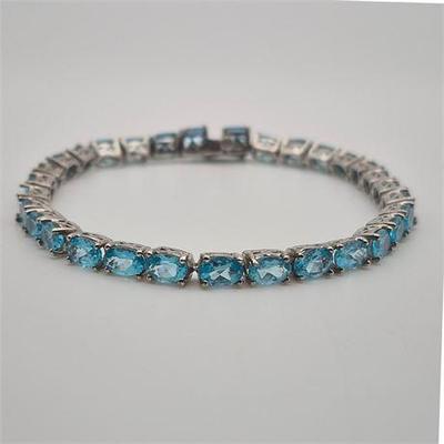 Sale Photo Thumbnail #31: Lot 045  
925 Sterling Silver Blue Topaz Tennis Bracelet
