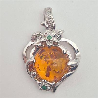 Sale Photo Thumbnail #13: Lot 013  
925 Sterling Silver Amber Pendant w/ Emerald Accents