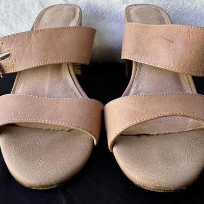 Stylish women’s slip-on pumps featuring an allover perforated upper with subtle reflective dot