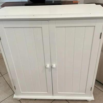 White Two-Door Storage Cabinet with Beadboard Panels