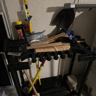 Garage Tool Organizer with Assorted Yard Tools and Supplies