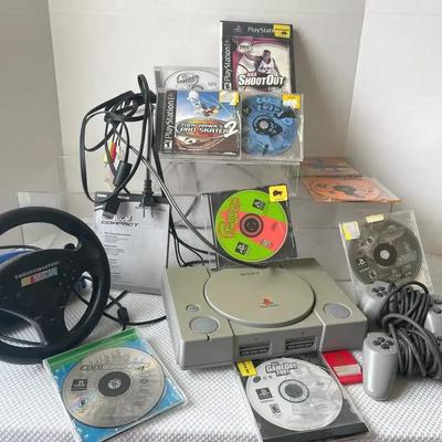 Sony Playstation With 10 Games, 2 Controllers, Memory Card And Driving Wheel