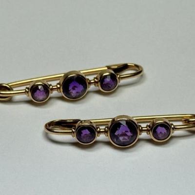 Pair of 14k yellow gold pins each with 3 bezel set amethysts, mark not found, tested 14k, 4.2g