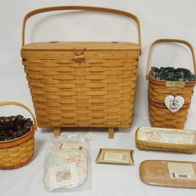 Sale Photo Thumbnail #84: 1084	ASSORTED LONGABERGER BASKETS INCLUDING 1992 MAGAZINE BASKET WITH ATTACHED LID, 1994 BEE BASKET SIGNED BY WENDY & JUDY, 2003 MOTHER DAY BASKET WITH 2 LIDS, HANG TIE, LINER AND PROTECTOR, LARGEST APPROXIMATELY 15 1/2 IN X 8 IN X 12 IN H
