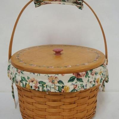 Sale Photo Thumbnail #93: 1093	ASSORTED LONGABERGER BASKETS INCLUDING 2000 HOSTESS BASKET WITH STACKABLE PROTECTORS, LINER, LID AND SEWING CONTENTS
