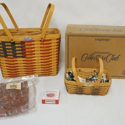 Sale Photo Thumbnail #96: 1096	ASSORTED LONGABERGER BASKETS INCLUDING 1998 COLLECTORS CLUB FLAG BASKET WITH PROTECTOR AND 1999 WOVEN MEMORIES BASKET WITH LINER AND SIGNED BY 3 FAMILY MEMBERS, LARGEST 15 1/2 X 8 1/2 X 12 IN H
