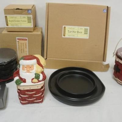 Sale Photo Thumbnail #88: 1088	ASSORTED LONGABERGER BASKETS INCLUDING 2010 SANTA CHIMNEY STOCKING HOLDER WITH BASKET, LID AND HOLDER, 2010 SANTA BELLY BASKET WITH LINER, PROTECTOR AND LID, 2010 SNOWMAN HAT BASKET WITH LID AND LINER AND TOP HAT BASE, LARGEST APPROXIMATELY 6 IN DIA 