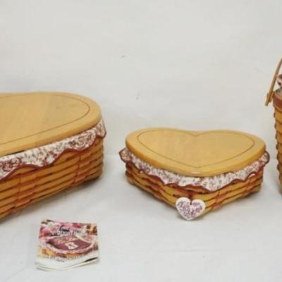 Sale Photo Thumbnail #98: 1098	ASSORTED LONGABERGER BASKETS INCLUDING 1999 MED AND LARGE HEART BASKETS WITH LIDS, LINERS AND PROTETORS, 1996 SWEETHEART BASKET WITH LINER AND PROTECTOR
