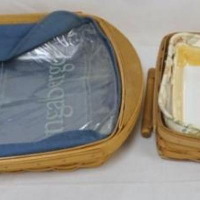 Sale Photo Thumbnail #85: 1085	ASSORTED LONGABERGER BASKETS INCLUDING LARGE 2009 SERVING BASKET WITH LINER AND PROTECTOR, 2011 HANDLED SERVING BASKET WITH LINER AND GLASS BAKING DISH, LARGEST APPROXIMATELY 23 IN X 13 1/2 IN X 3 1/2 IN H
