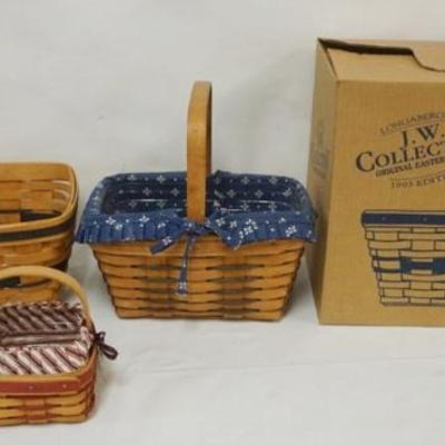 Sale Photo Thumbnail #97: 1097	ASSORTED LONGABERGER BASKETS INCLUDING 1993 J.W. ORIGINAL EASTER BASKET  WITH BOX, 1994 MED GATHERING BASKET WITH LINER AND PROTECTOR, AND  1994 BASKET WITH LINER AND PROTECTOR LARGEST APPROXIMATELY 16 IN X 9 IN X 12 IN H
