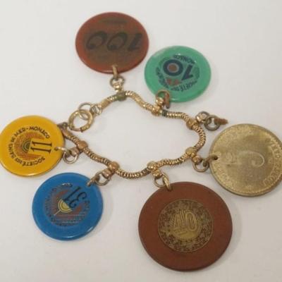 Sale Photo Thumbnail #119: 1119	UNUSUAL GAMING CHIP BRACELET WITH CHIPS FROM MONACO, MONTE CARLO, AND OTHERS
