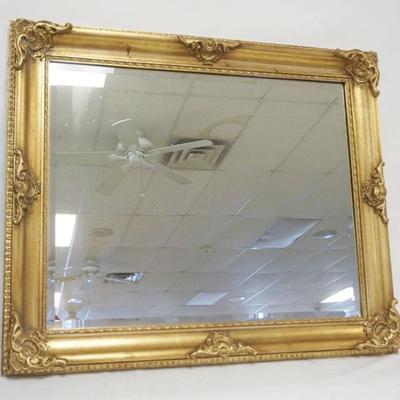 Sale Photo Thumbnail #207: 1207	BEVELED EDGE WALL MIRROR IN GILT FRAME, APPROXIMATELY 31 IN X 37 IN
