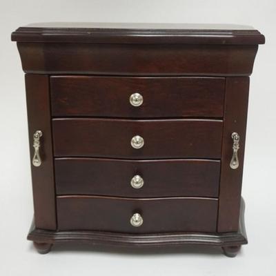 Sale Photo Thumbnail #100: 1100	MAHOGANY FINISHED WOOD JEWELRY CHEST HAVING A LIFT TOP, 2 DOORS AND 4 CENTER DRAWERS, APPROXIMATELY 14 IN X 9 IN X 13 IN H

