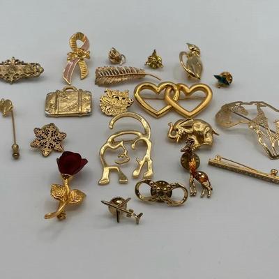 Gold-Toned Pin and Broach Collection with Wild Bryde Africa Pin and Feather Labeled 14k