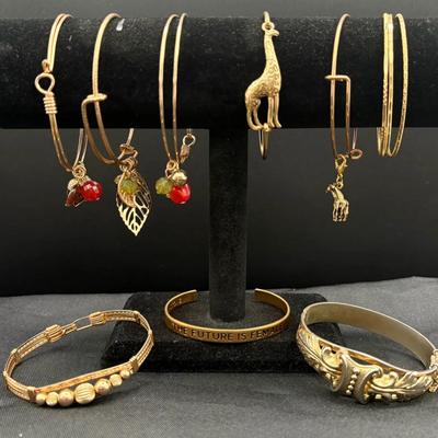 Collection Of Gold-Toned Bangle Bracelets And Cuff