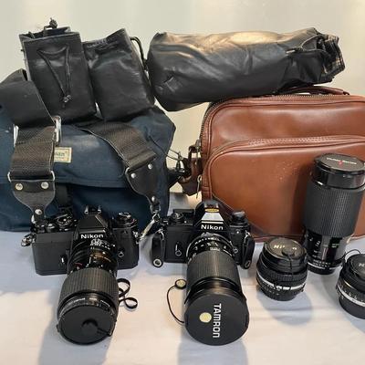 (2) Nikon EM Film Cameras, Three Lenses And Camera Bags