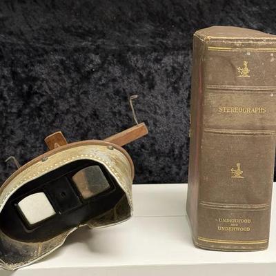 antique Underwood & Underwood stereoscope viewer and a book-style case for stereograph cards