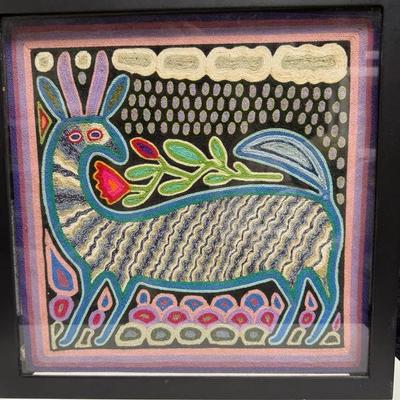 traditional Mexican folk art piece known as a Huichol yarn painting, or tabla de estambre
