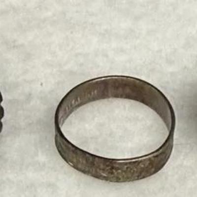 collection of vintage Native American sterling silver rings, including a Navajo green turquoise ring