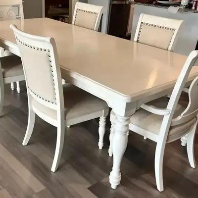 White Wooden Dining Table with Six Chairs, Including Two Captain’s Chairs
