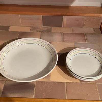 Ceramic Serving Bowl and Three Smaller Bowls with Multicolor Stripe Design	A large ceramic serving b
