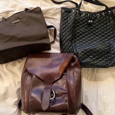 Three Bags: Brown Leather Backpack, Black Quilted Tote, and Brown Fabric Tote