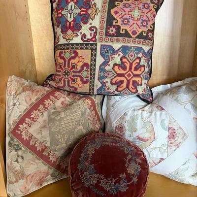 Decorative Throw Pillows with Needlework and Patchwork Designs