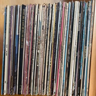 Vinyl Records Including Woodstock and The Beatles

 