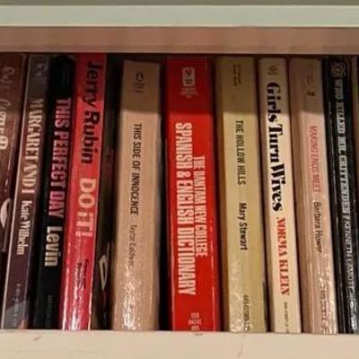 Bookshelf With a Collection of Mixed Paperback Books