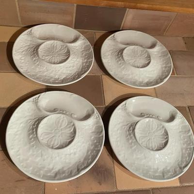 Four White Ceramic Oyster Plates with Floral Relief Design