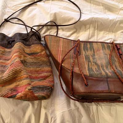 Two Leather and Textile Shoulder Bags with Drawstring and Woven Designs