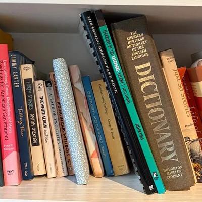 Various Genres of Hardcover and Paperback Books