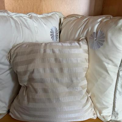 Decorative Pillows with Embroidered and Striped Designs
