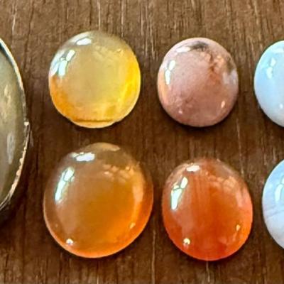 (6) Assorted Peach & White Moonstone Cabochons & One Silver Edge Clear & Blue Stone